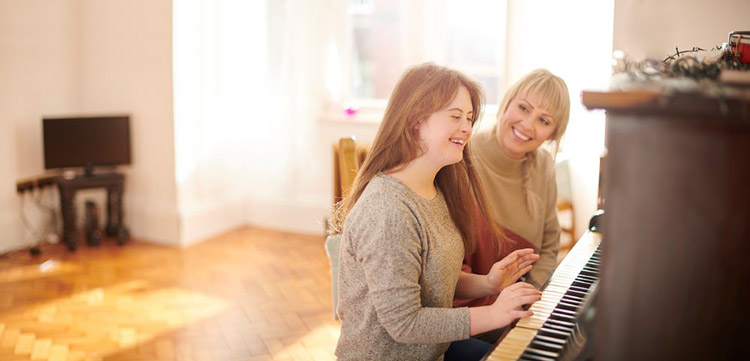 Woman with a developmental disability playing the piano