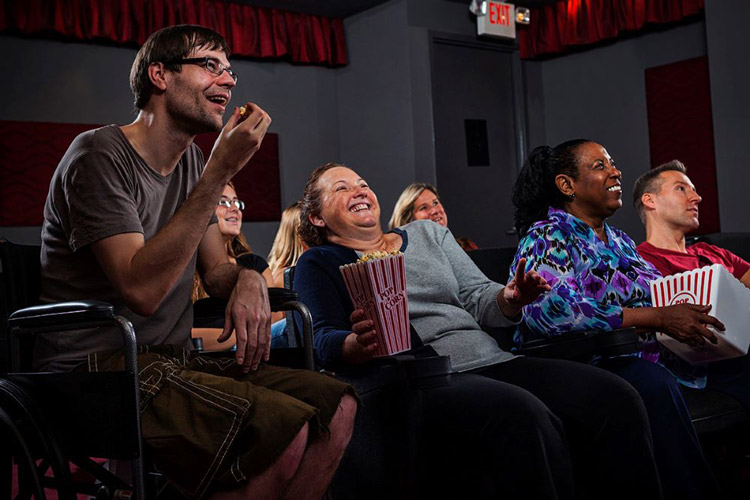 Group of people enjoying a movie in a theater