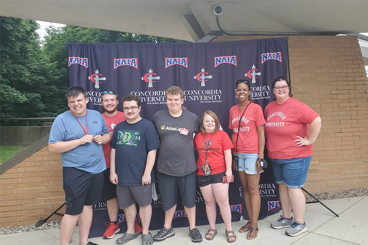 Group of students in front of the Ann Arbor location of AbleLight College