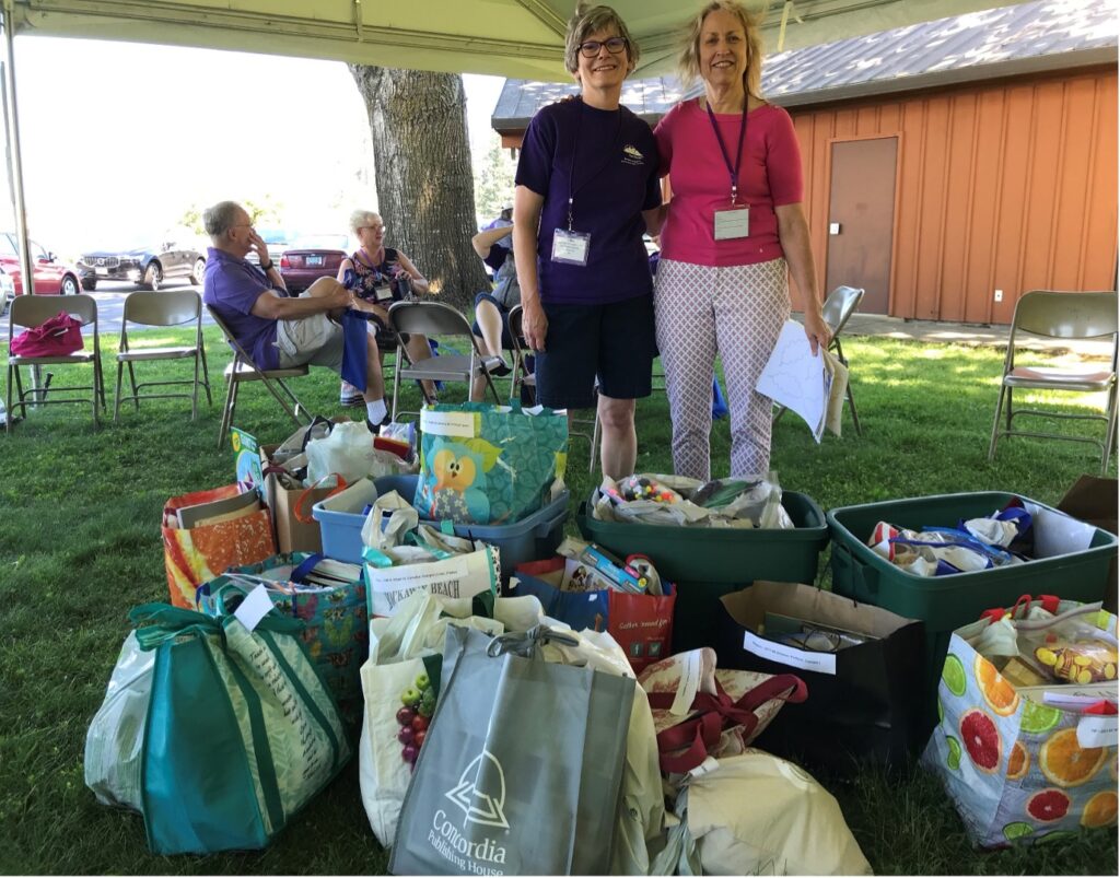In-gathering of craft supplies and kits: VP of Gospel Outreach Liz Bier and LWML member Sigrid Wright