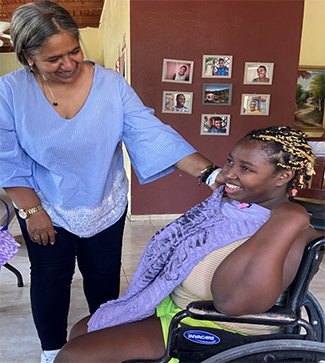 Dr. Marisol Martinez, group home director, with Estefani showing her new pretty blouse