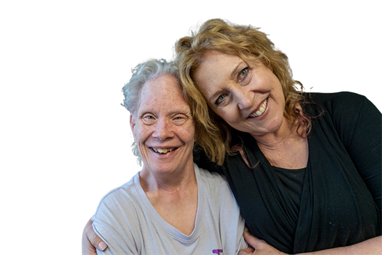 Cutout of a female caregiver with an older woman with IDD