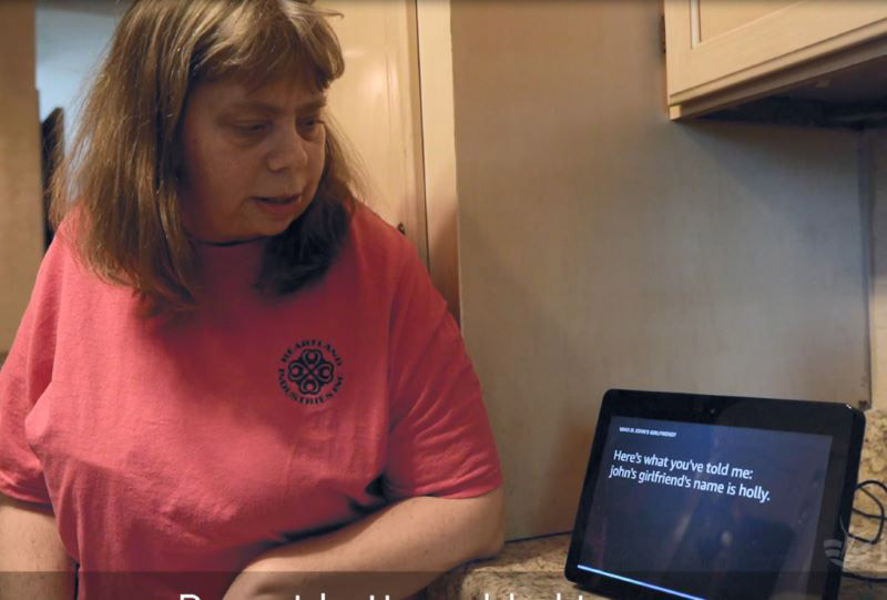 Woman with disabilities using Amazon Alexa in her home