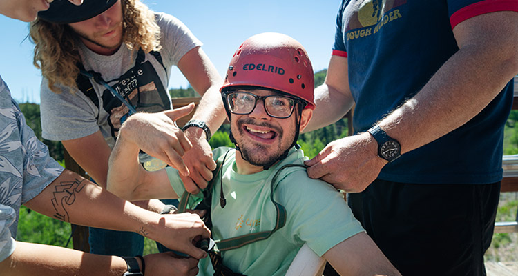 Chris is preparing to ride the zipline at AbleLight's Summer Camp
