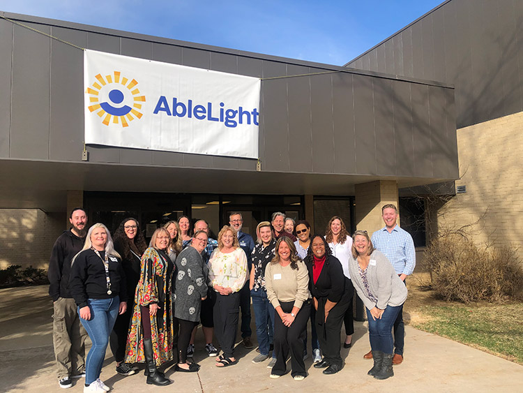 Group of AbleLight Employees in front of Day Program Center in Fort Collins