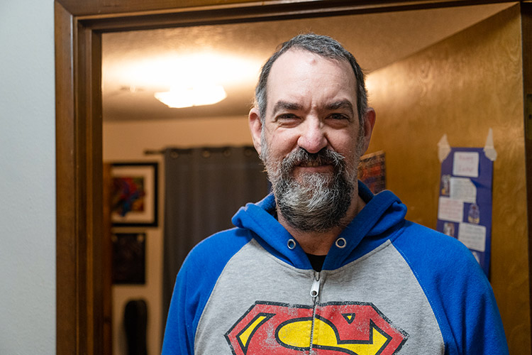 Ted in front of his room at an AbleLight Congregate Living home