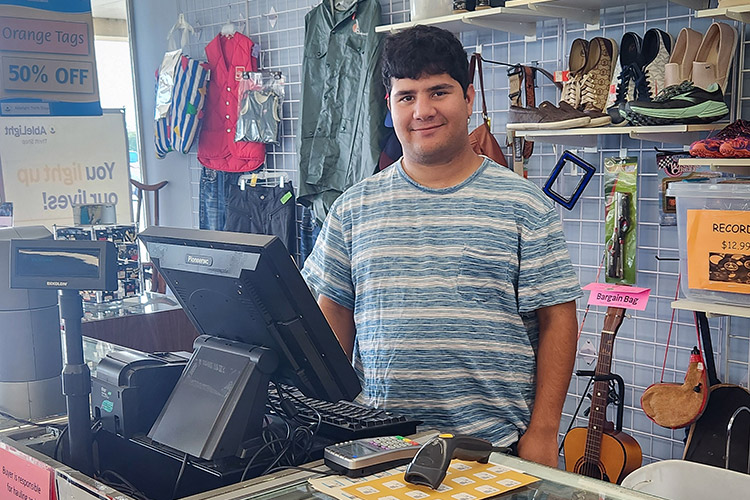 Man with a developmental disability working at a cash register