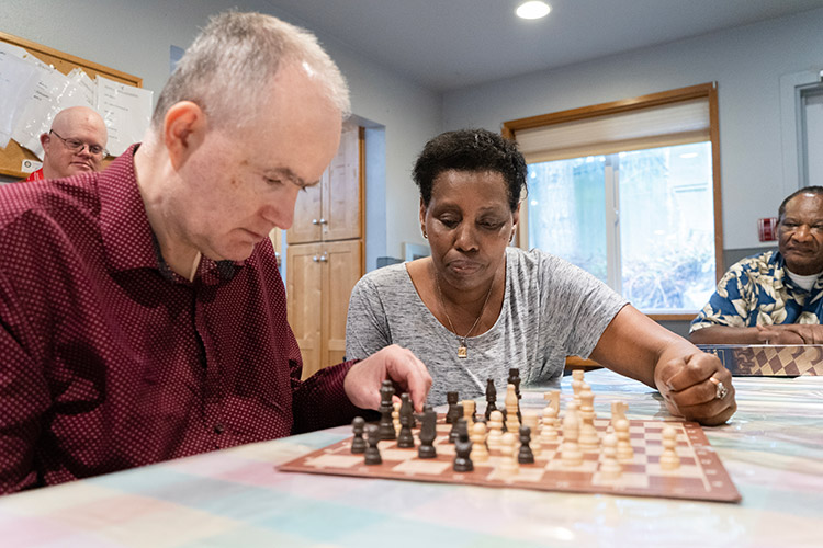 Paul and Alice playing chess in an AbleLight home