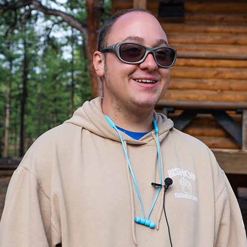 Skylar smiling outside at AbleLight camp