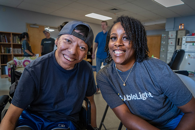 Tatiyana with Daven, a man supported by AbleLight