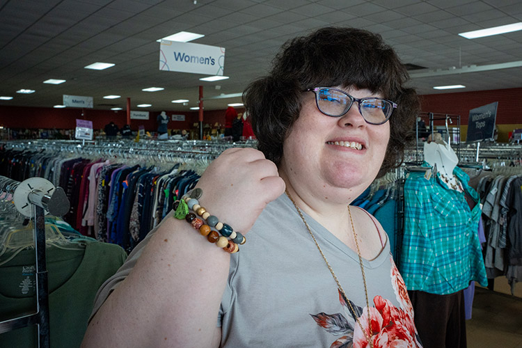 Nicole, a woman with a developmentally disability, working in an AbleLight Thrift Shop