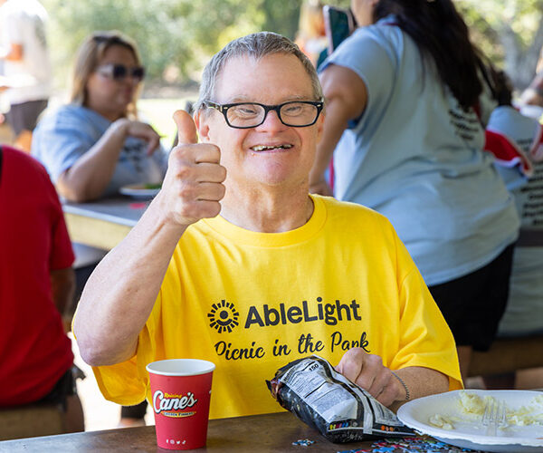 Woman with a developmental disability smiling outdoors