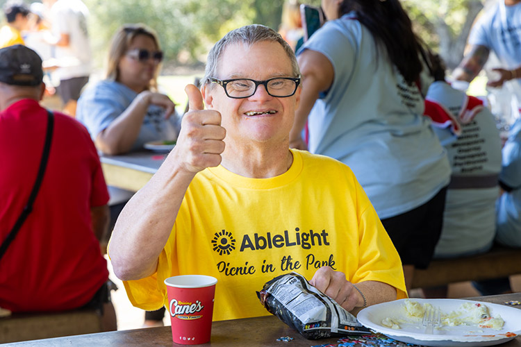 Woman with a developmental disability smiling outdoors