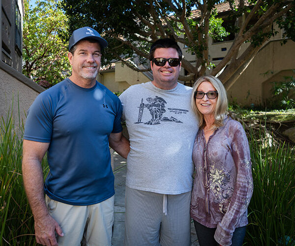 Ryan, a man with a developmental disability, with his family