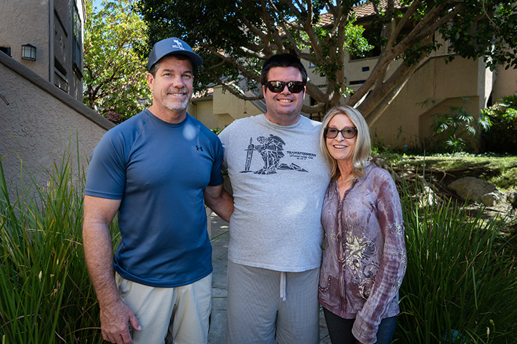 Ryan, a man with a developmental disability, with his family