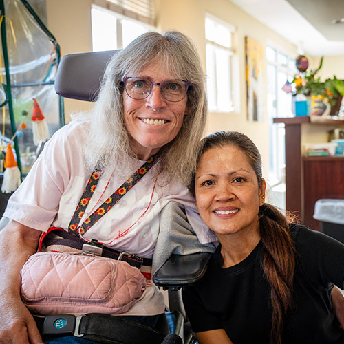 A female participant and team member from an AbleLight Day Program