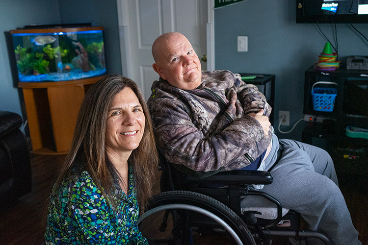 AbleLight team member with a man with a disability