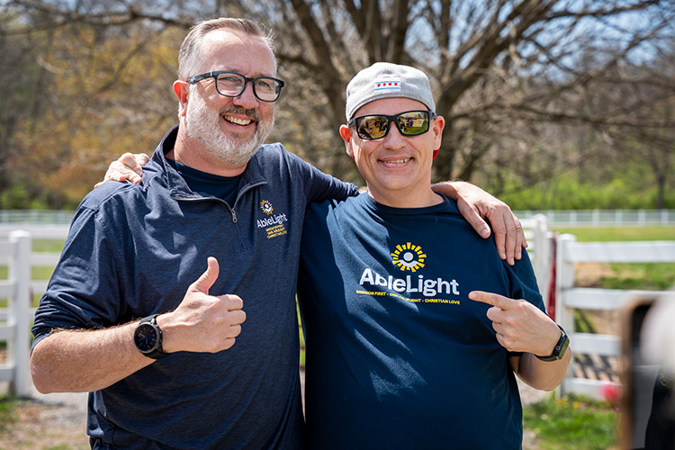 Keith Jones, AbleLight CEO with a man supported by AbleLight