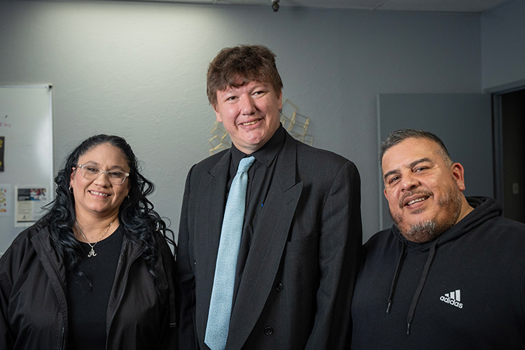 Two AbleLight job coaches with a man supported by AbleLight