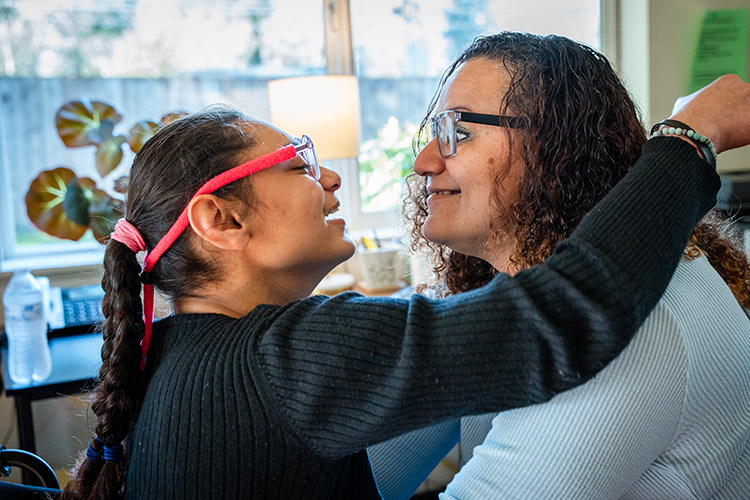 An AbleLight DSP with a woman supported by AbleLight