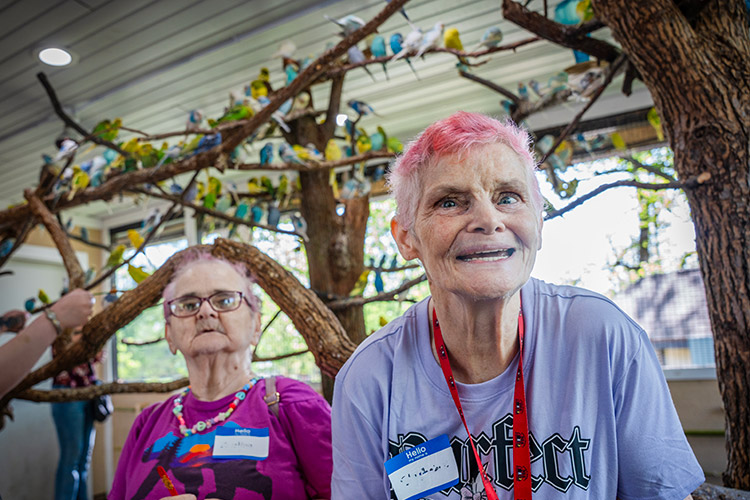 Two women supported by AbleLight outside
