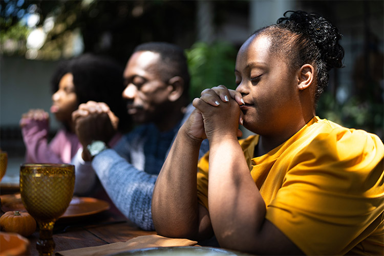 Two people praying at church