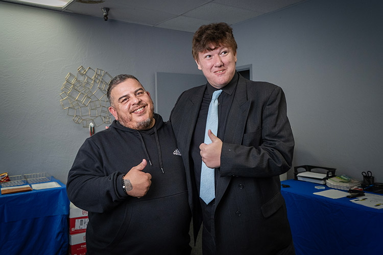 A man with IDD and an AbleLight Job Coach preparing for an interview
