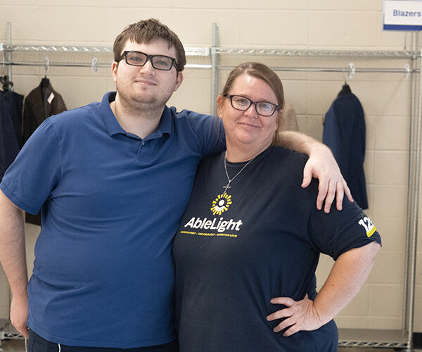 Two employees at AbleLight's thrift shop in St. Peters, Missouri