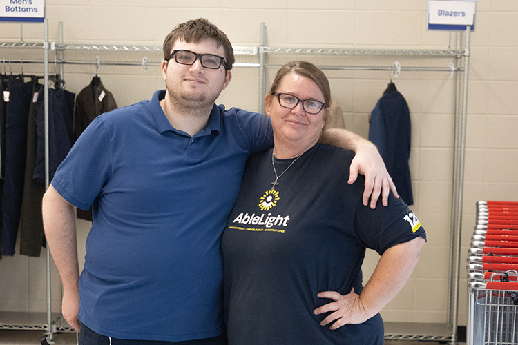 Two employees at AbleLight's thrift shop in St. Peters, Missouri