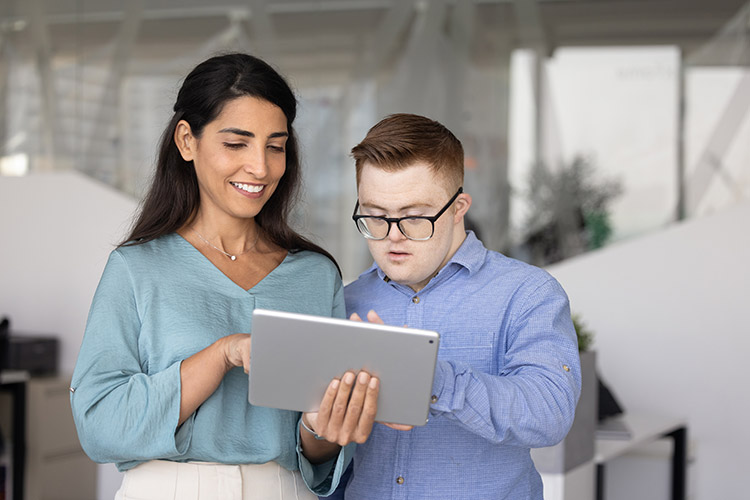 A man with a developmental disability working with a coworker