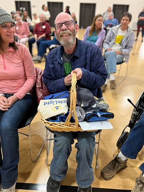Man with an AbleLight gift basket
